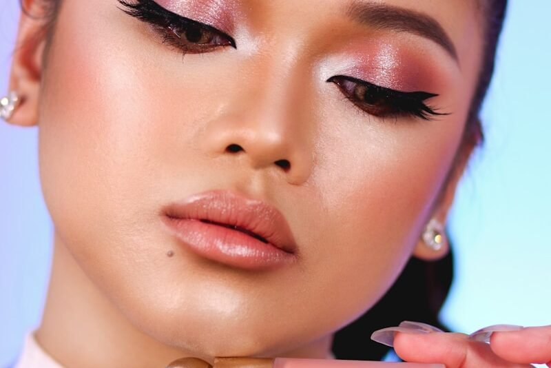 Woman applying Premium Beauty Product makeup