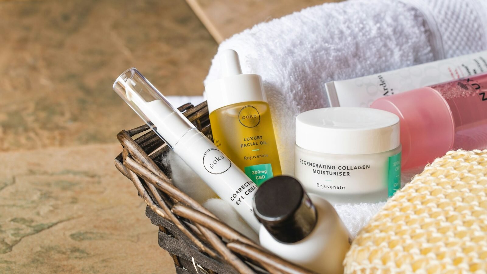  bottles on brown wooden basket of glowing skin products