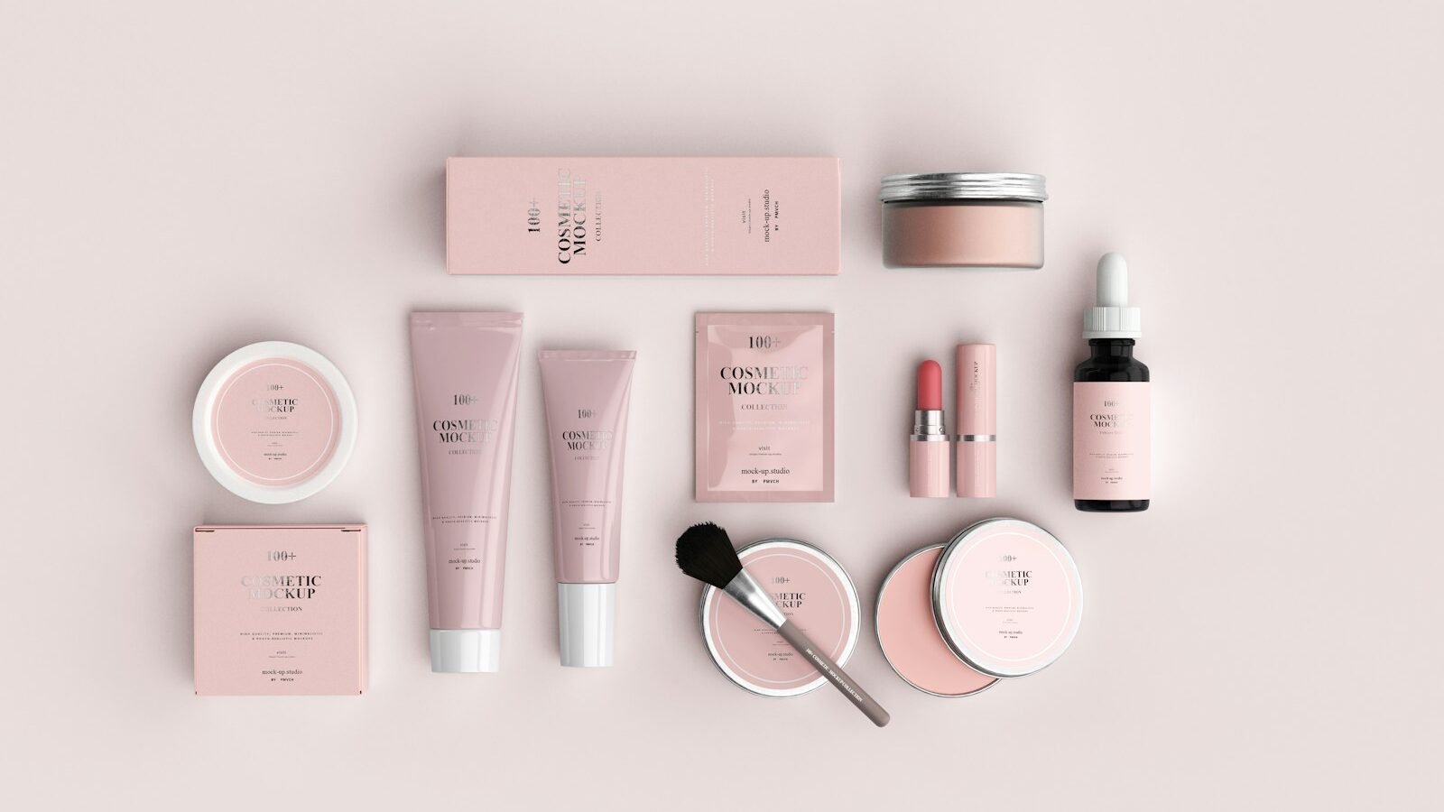 A collection of pink and black makeup brushes, arranged neatly on the surface.