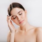 A woman holding her head in her hands